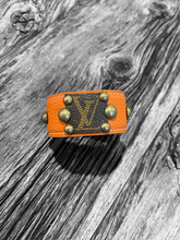 Load image into Gallery viewer, Studded Orange LV Cuff
